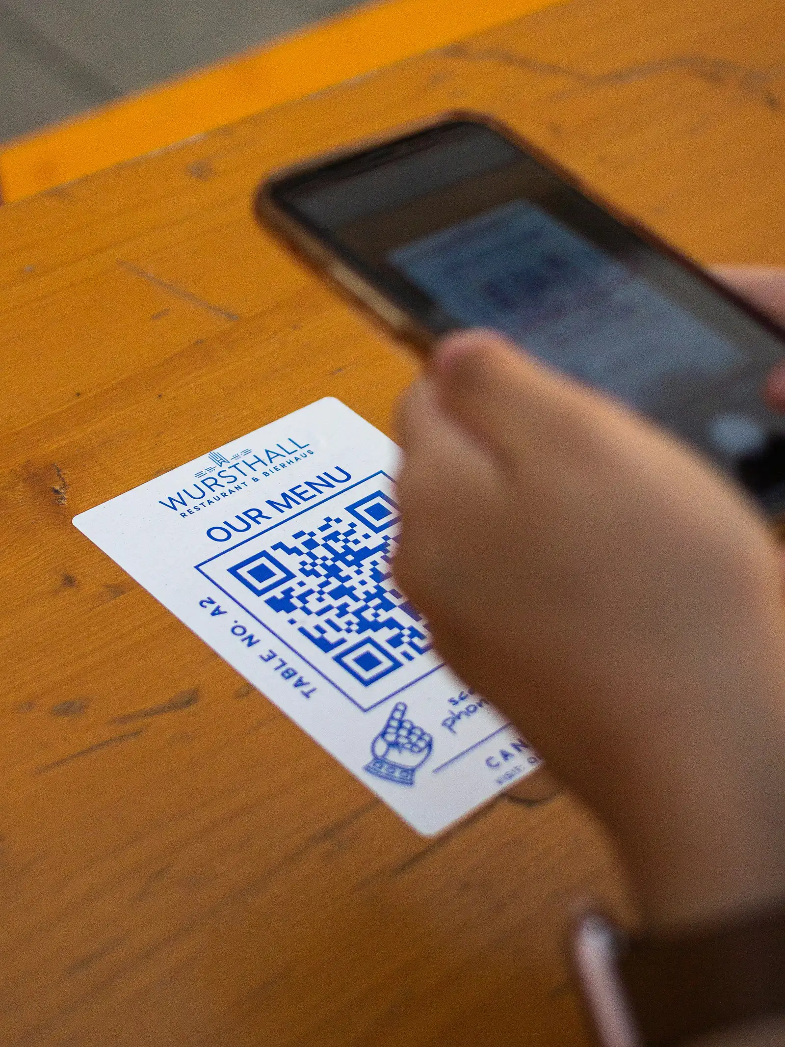 a person scanning a QR code for the menu